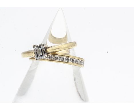 An 18ct gold fancy baguette cut diamond solitaire, and two colour 18ct gold wedding band, diamond 0.33ct, both ring size L 1/