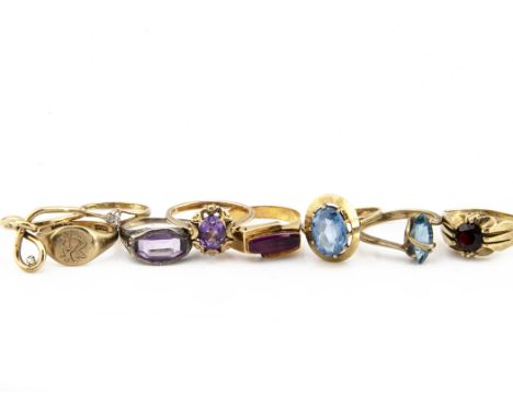 A collection of 9ct gold gem set rings, including an amethyst and diamond Art Deco example, ring size N, a synthetic ruby yel