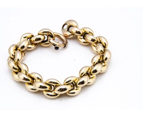 A continental 18ct gold oval linked bracelet, by Chiampesan Vettori, with a barrel snap clasp and onyx button, of large oval 