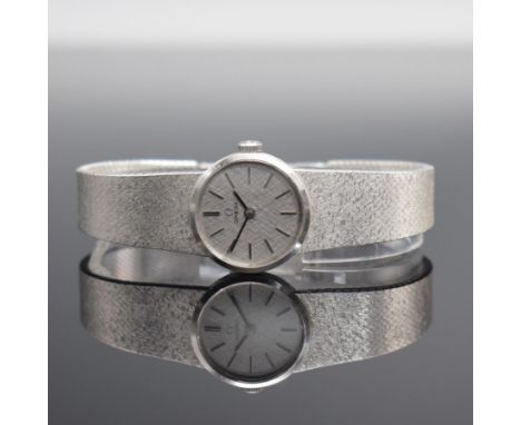 OMEGA Damenarmbanduhr in WG 585/000,  Schweiz um 1973, Handaufzug, Boden aufgedr., orig. Milanaiseband in WG 585/000, silb. S