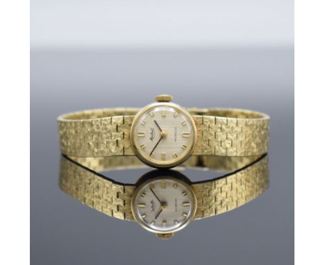 MONTRIAL Damenarmbanduhr in GG 585/000,  Schweiz um 1965, Handaufzug, 2-teil. Geh., Boden aufgedr., Goldband in GG 585/000, s