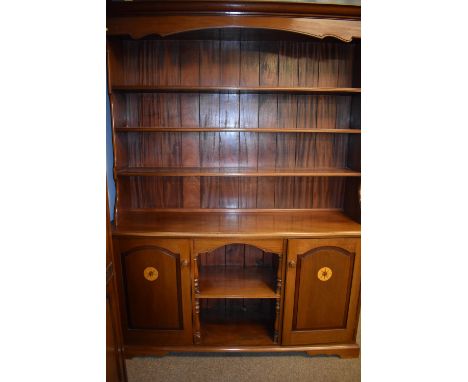 A 20th Century mahogany and inlaid bookcase by Stephen Robinson Gay, with projecting cornice and bank of four shelves, above 