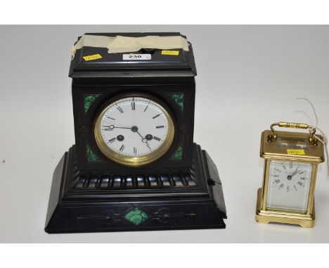 A brass carriage clock by London Clock Co; and a French black marble mantel clock by S. Marti et Cie. (2)