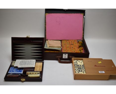 Boxed dominoes Double 12 Mexican train; a cased Games Compendium with backgammon, bridge playing cards, dominoes, etc; and a 