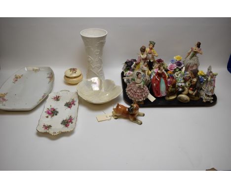 Assorted porcelain figures by Hummel, Dresden and others; posy ornaments; an Arthur Wood vase; and other items.