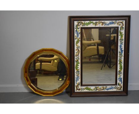Two 20th Century wall mirrors comprising, a rectangular wall mirror, with central mirror plate enclosed by ceramic tiles, dec