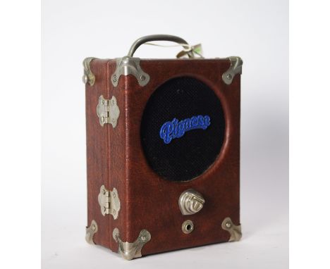 A Pignose model 7-100 portable guitar amplifier, serial number 6844, with single input and volume control, single pre-amp out