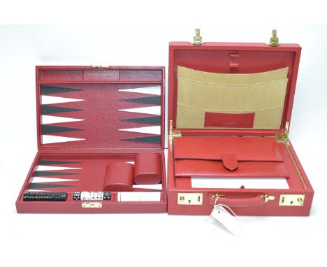 Smythson of Bond Street: a red leather correspondence case, wallet and backgammon game. (3)