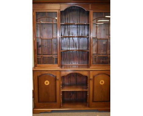 A 20th Century mahogany and inlaid dresser, with projecting cornice above two astragal glazed doors and central recess, above