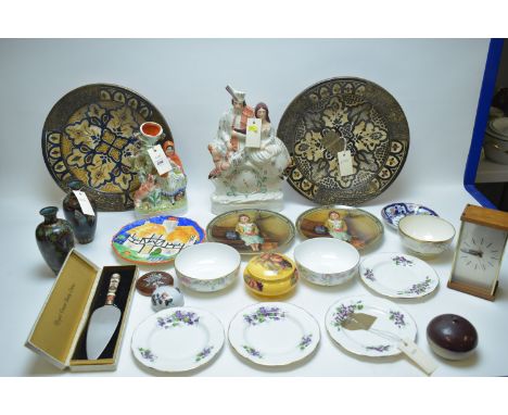 Two Middle Eastern tin-glazed earthenware brass-bound bowls; two Staffordshire figures; a Westclox Quartzmatic mantel clock; 