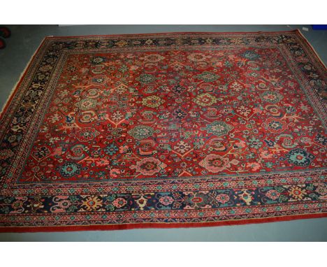 Ferahan carpet, with floral scrolling decoration on red ground, 296 x 291cms.