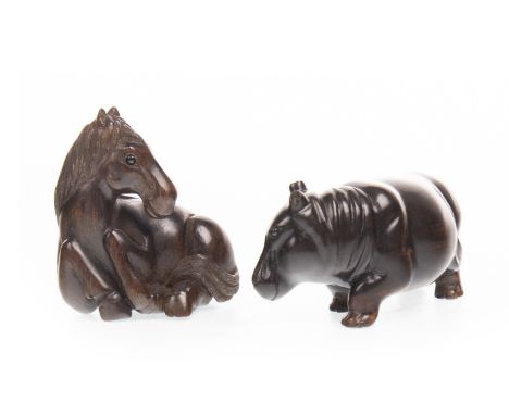 20TH CENTURY JAPANESE NETSUKE, of carved wood, modelled as a rhino, signed, 5.5cm long, along with a netsuke of carved wood m