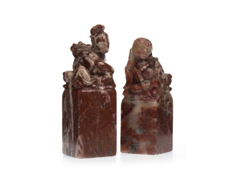TWO 20TH CENTURY CHINESE HARDSTONE SEALS, each with figural finial, the larger 11cm high
