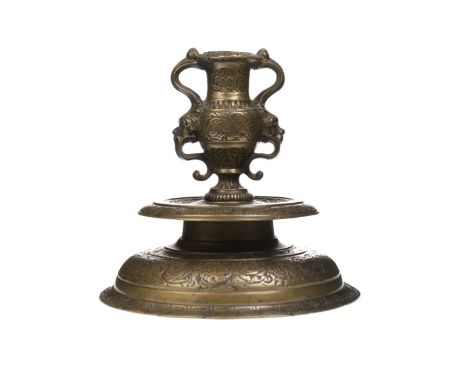 VENETIAN (VENETO) ISLAMIC BRASS CANDLESTICK, with twin handled urn shaped sconce over a circular mid stage and domed base, wi