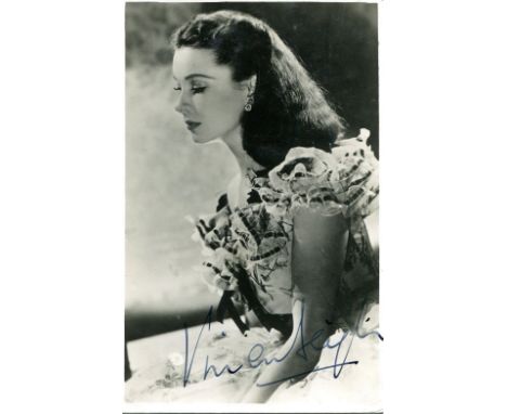 LEIGH VIVIEN: (1913-1967) English Actress, Academy Award winner. A good vintage signed postcard photograph of Leigh seated in