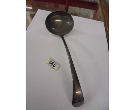 A silverplate soup ladle.