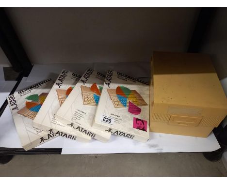 Four boxed vintage Atari 1040ST family curriculum and a file box with contents.