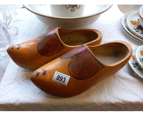 A pair of vintage wooden clogs