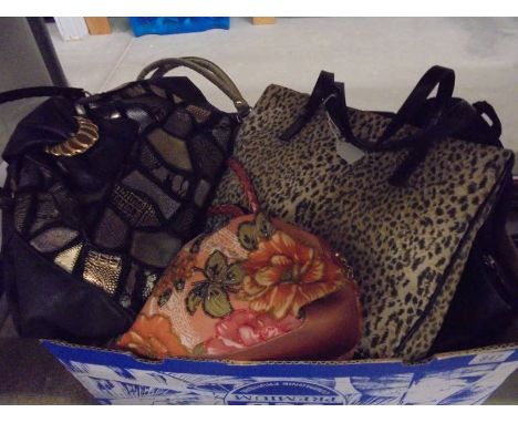 A box of vintage hand bags.