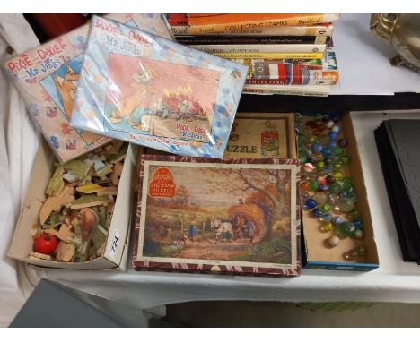 A quantity of vintage jigsaw puzzles (completeness unknown) marbles etc.,