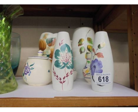 Four vases, a jam pot, salt and pepper pots including Poole Pottery.