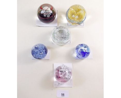 A collection of six Caithness glass paperweights: 'Tawny Owl', 'The Firefly', 'Touchdown', 'Raindrop' and two 'Mooncrystal' e