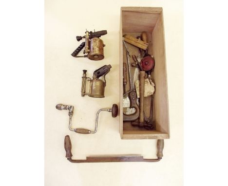A box of old tools and two blow torches