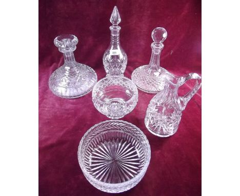 A selection of cut glass including two ships decanters, another decanter, jug and two fruit bowls