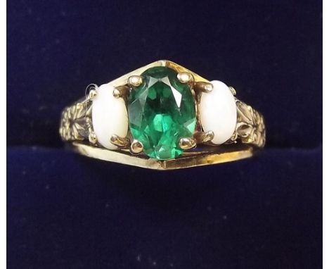 A 9 carat gold opal and green stone ring, size K