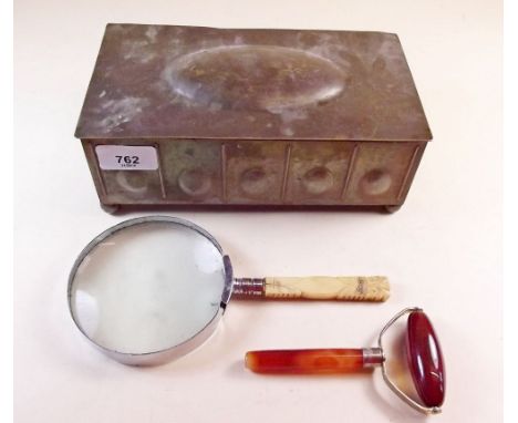 A brass Arts and Crafts box, an agate roller and a magnifying glass