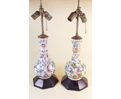 A pair of Chinese Canton style lamp bases decorated butterflies etc