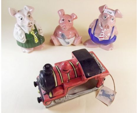 Three Wade Nat West piggy banks with a Van Hill pottery train nursery lamp