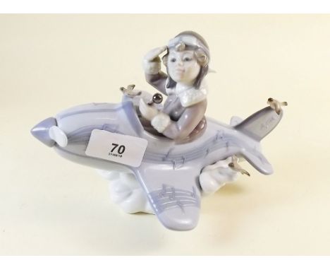 A Lladro group boy in an aeroplane  - 13cm tall