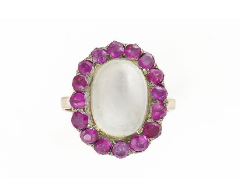 A GOLD, MOONSTONE AND RUBY OVAL CLUSTER RINGMounted with the oval moonstone within a surround of variously cut rubies, unmark