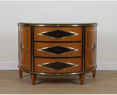 A 18TH CENTURY RUSSIAN STYLE GILT METAL MOUNTED FRUIT WOOD DEMI LUNE COMMODEWith three drawers flanked by cupboards, 124cm wi