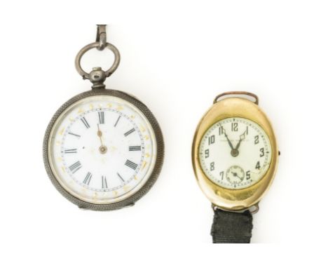 A TAVANNES WATCH CO GOLD OVAL CASED LADY'S WRISTWATCH AND A SILVER FOB WATCH AND CHAIN (3)The Tavannes watch with a signed ci