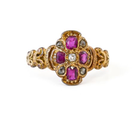 A RUBY AND DIAMOND RING (2)Set with four oval mixed cut rubies, and five old and rose cut diamonds, in an unmarked mount with