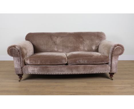 A TAUPE VELVET UPHOLSTERED SOFAWith studded rollover arms, 220cm wide; 88cm highThe sofa is 96cm deep&nbsp;