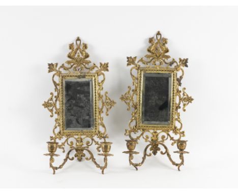 A PAIR OF GILT-BRASS REGENCE STYLE TWIN LIGHT WALL GIRANDOLES (2)Late 19th Century 
With bevelled rectangular mirror plates, 