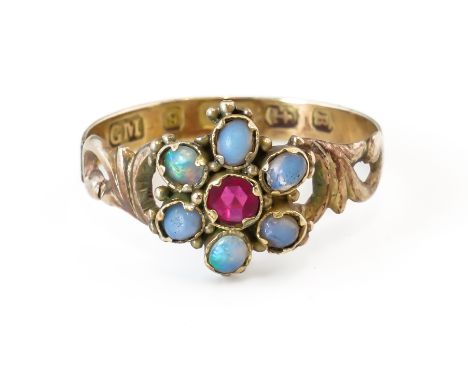 A VICTORIAN 9CT GOLD, OPAL AND RED GEM SET SEVEN STONE CLUSTER RINGMounted with a synthetic red gem at the centre within an o