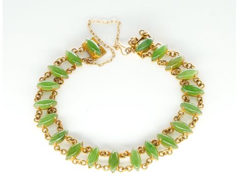 A GOLD AND MARQUISE SHAPED PALE NEPHRITE BRACELETThe rectangular snap clasp detailed 9 CT, gross weight 10.4 grams