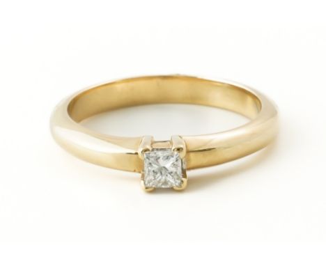 A GOLD AND DIAMOND SINGLE STONE RINGClaw set with a princess cut diamond weighing an estimated 0.23 carats, with an estimated