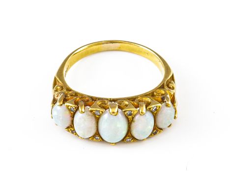 A GOLD, OPAL AND DIAMOND RINGSet with a row of five graduated cabochon opals interspersed by four pairs of small diamonds in 