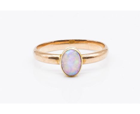 A GOLD AND OPAL SINGLE STONE RINGCollet set with an oval opal, unmarked, ring size J½, gross weight 1.9 grams