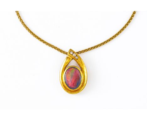 A GOLD, DIAMOND AND GREY OPAL PENDANT WITH CHAINThe pendant of polished oval form and set with a grey opal cabochon and three