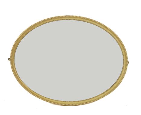 A CREAM PAINTED OVAL WALL MIRROR (2)With split bobbin decorated frame 111cm wide; 85cm high, and a gilt framed oval mirror, 8