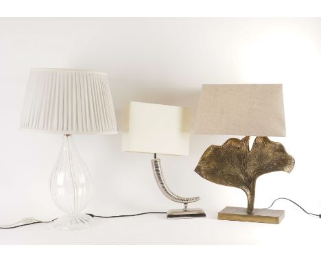 THREE TABLE LAMPS INCLUDING ONE MODELLED AS A HORN (3)Modern
The silvered horn lamp on rectangular base with cream shade, bas