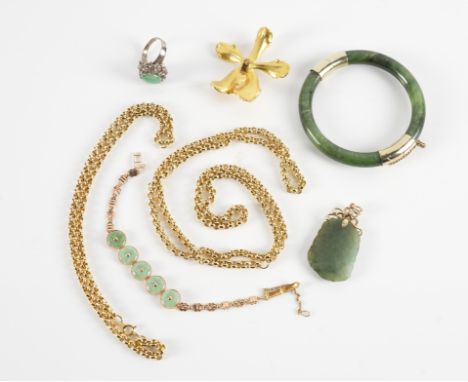 A COLLECTION OF JEWELLERY (7)Including a jade hinged bangle, a carved jade pendant, a jade set bracelet, a jade set ring, all