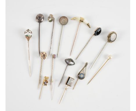 A COLLECTION OF FIFTEEN STICK PINS (15)To include; a rectangular mosaic stick pin, with a bird motif, a cultured pearl stick 