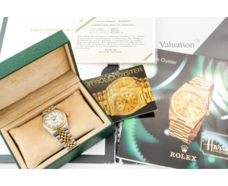 A ROLEX OYSTER PERPETUAL DATEJUST STEEL AND GOLD GENTLEMAN'S BRACELET WRISTWATCHThe signed white dial with gilt Roman hour ma